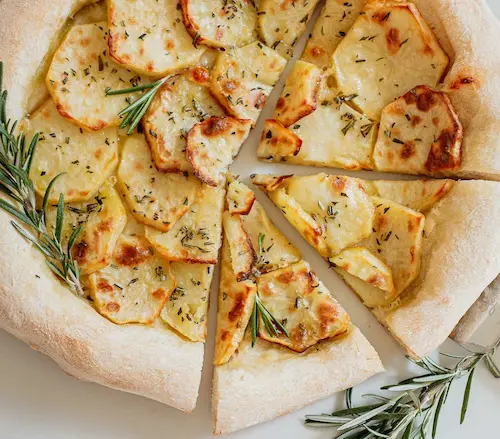 Potato pizza on a wooden board